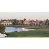 The finishing hole of the TPC Blue Monster at Doral Golf Resort & Spa glows at dusk. 