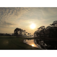 Don't miss the sunset view of the 13th hole and Choctawhatchee Bay at Burnt Pine Golf Club in Destin, Florida.